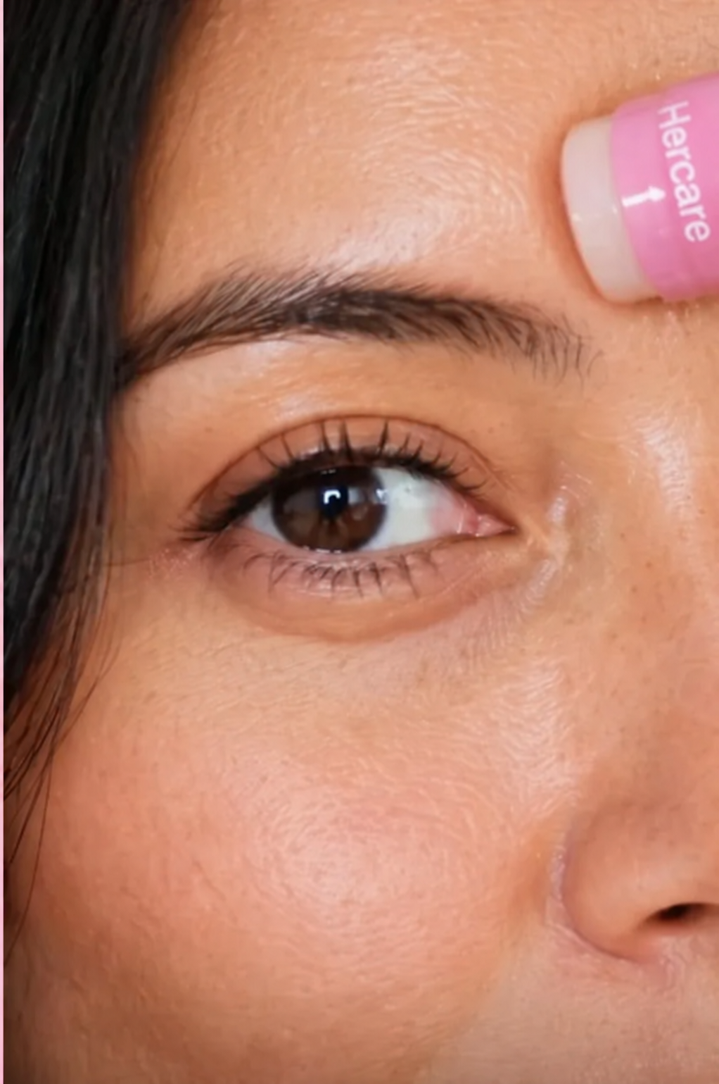 Hercare balm applied to the forehead